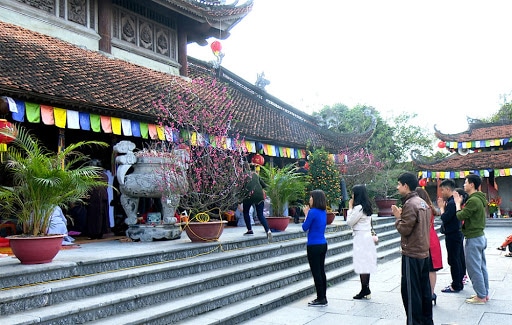 going to the worship at temples and pagodas during Tet